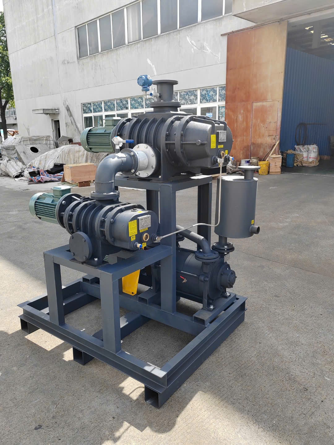 ZT Pumps Roots booster vacuum system with backing pump on an integrated skid