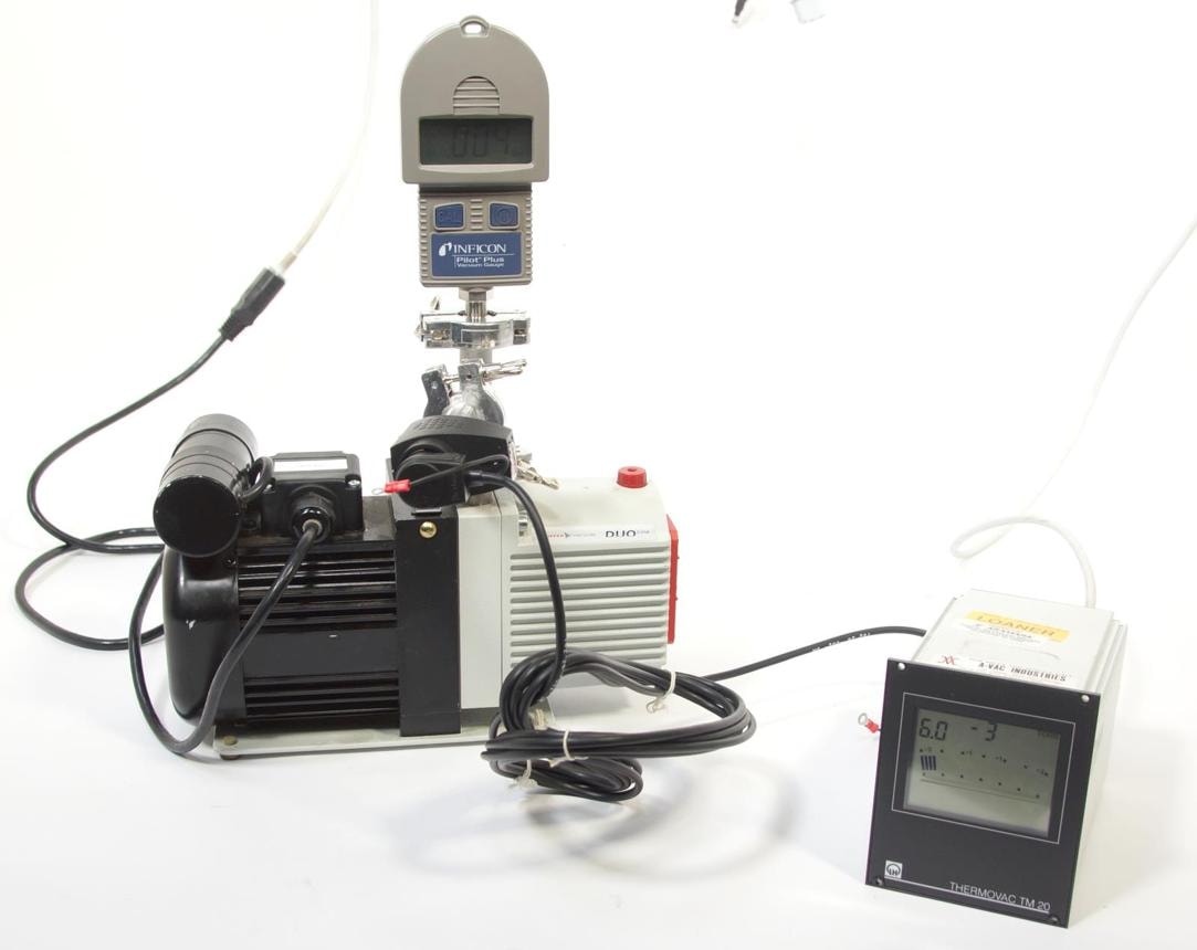 Pirani vacuum gauge used to measure pressure at the inlet of a rotary vane vacuum pump